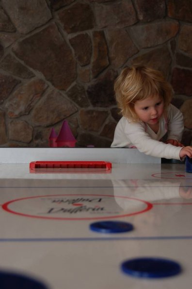 Dee sure liked air hockey